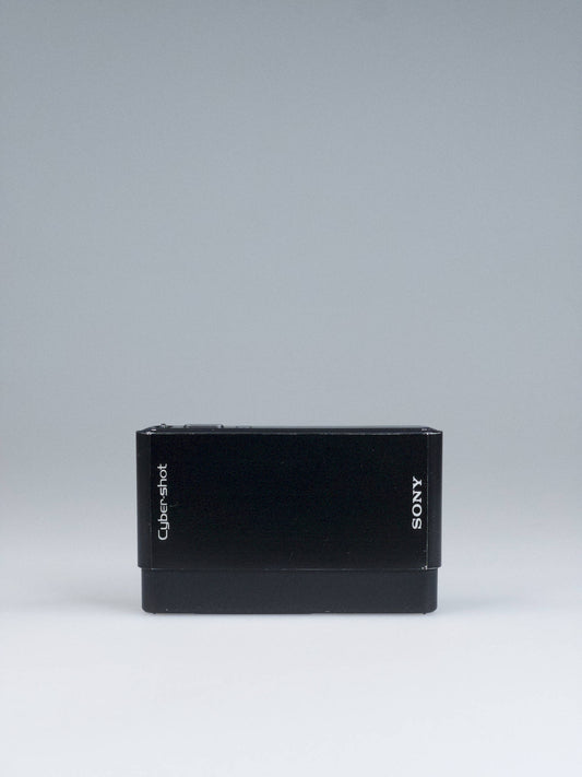 Sony Cyber-shot DSC-T77 in high-gloss black, sliding lens cover closed, on Bling Inc.