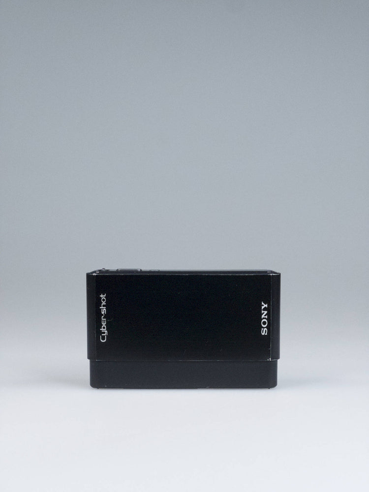 Sony Cyber-shot DSC-T77 in high-gloss black, sliding lens cover closed, on Bling Inc.